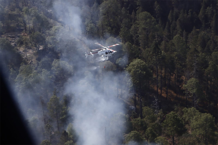 Mantienen tres órdenes de gobierno trabajos de liquidación de incendio de Libres